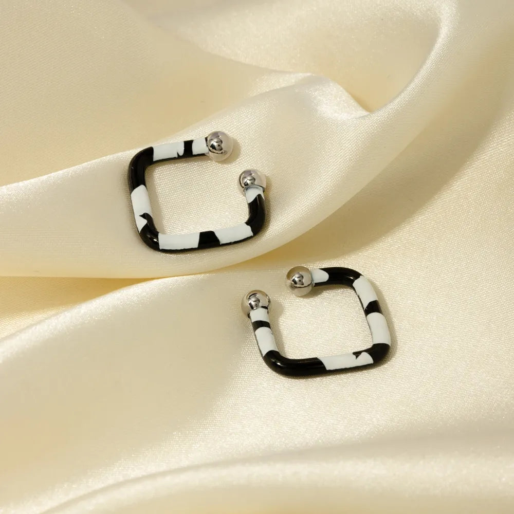 Molten Moon Cuff Earrings in polished multicolor stainless steel
